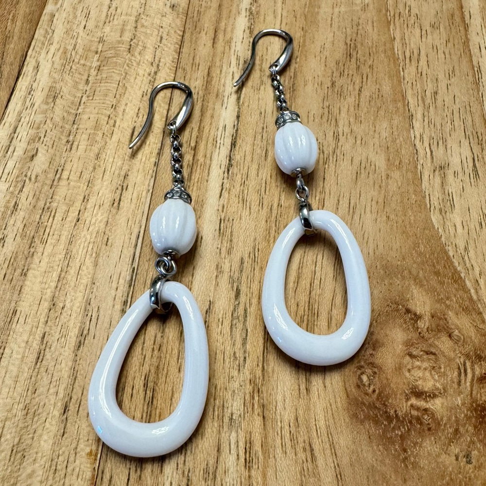 Fossil white ceramic & silver dangle earrings with hook posts and glass crystals